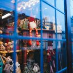 A window display of holiday toys arranged behind a window