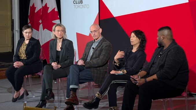 2025-01-21 CMA Panel 5 Panelists seated on stage with Canada's Podium sign behind him.