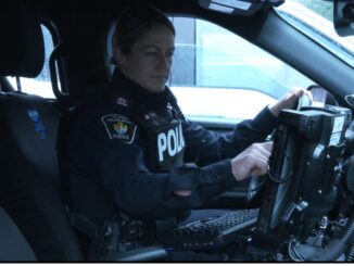police officer sitting in car.